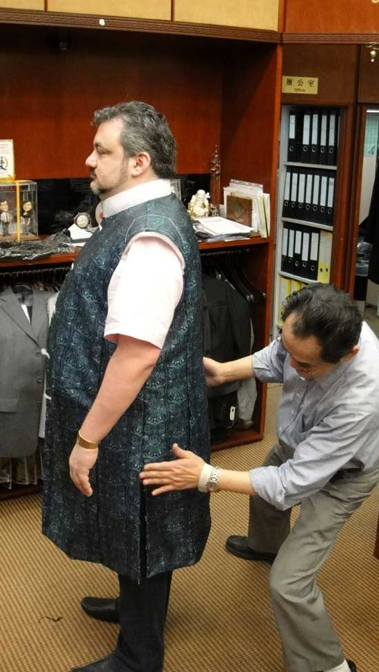 Daniel Michael being fitted by taylor